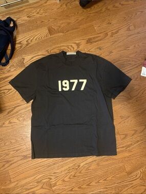 Fear of God Essentials Iron Tee with Cream 1977 Design